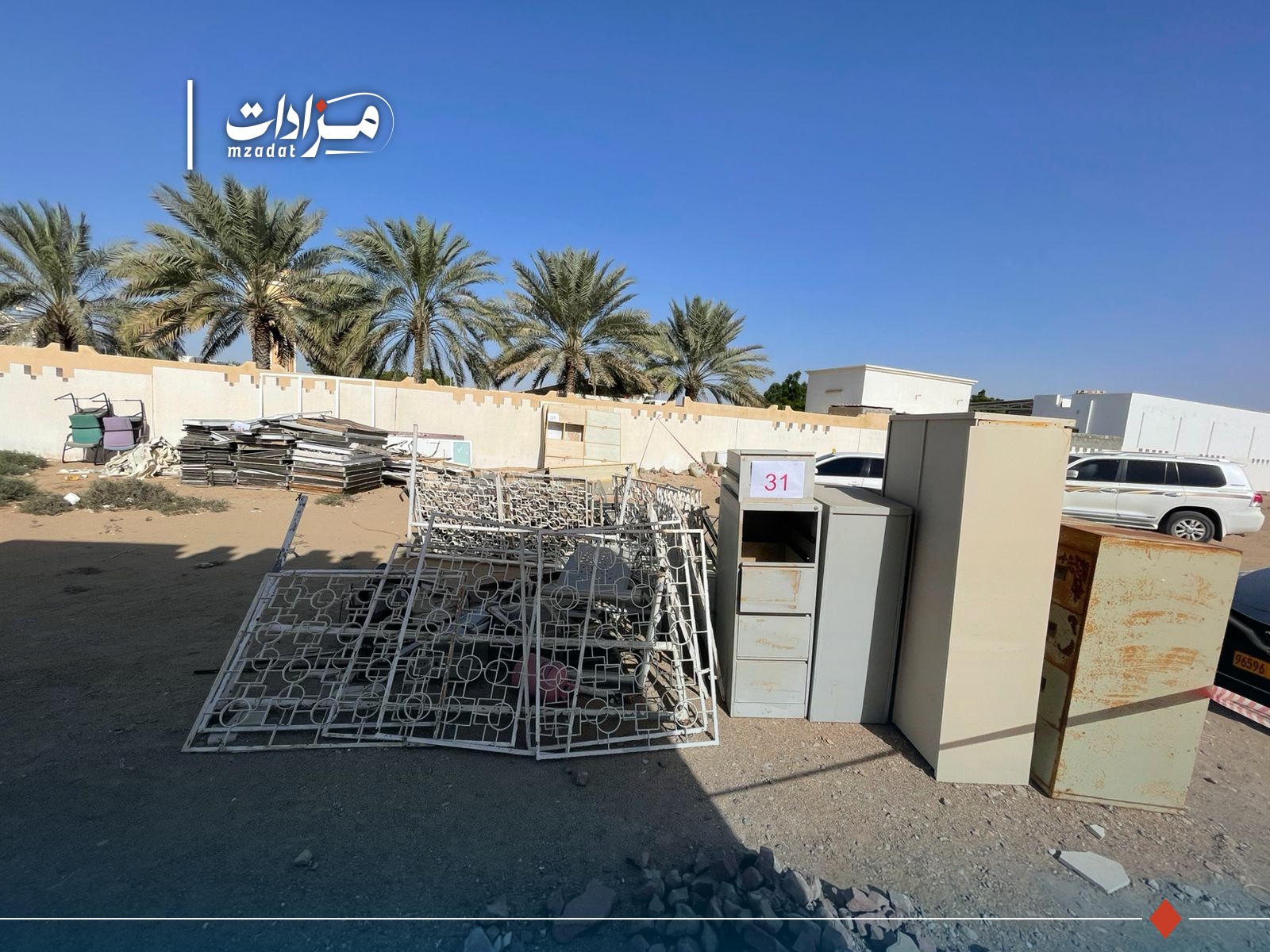 31-Office furniture + aluminum and wooden doors + metal cabinets + electrical wires + scrap metal + windows + water heaters